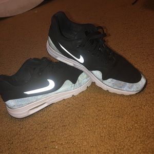 Black nike athletic shoes